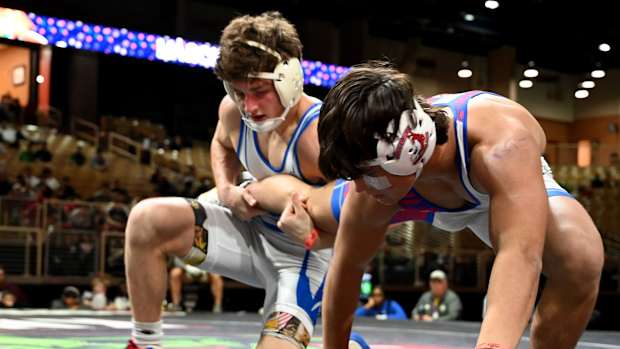 Anderson Heap from Osceola wins the 150-pound championship against Dallas Russell of Jefferson on Saturday at the Knockout Christmas Classic at Silver Spurs Arena in Kissimmee. 